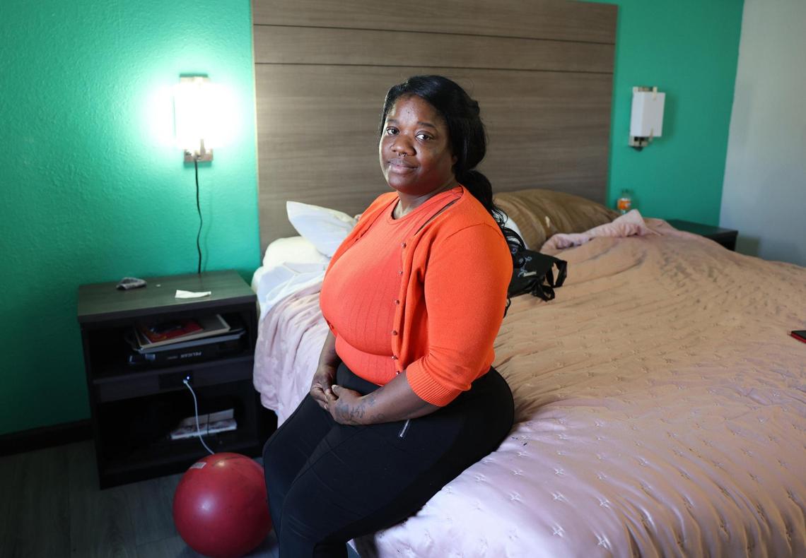 Quenanecha Williams sits on her bed at a local Rock Hill hotel Friday.