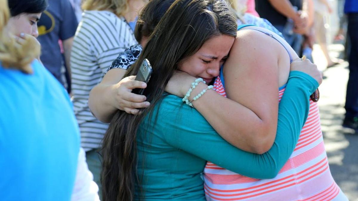 
A woman is comforted as friends and family wait for students at the local fairgrounds after a shooting at Umpqua Community College in Roseburg, Ore., on Thursday.

