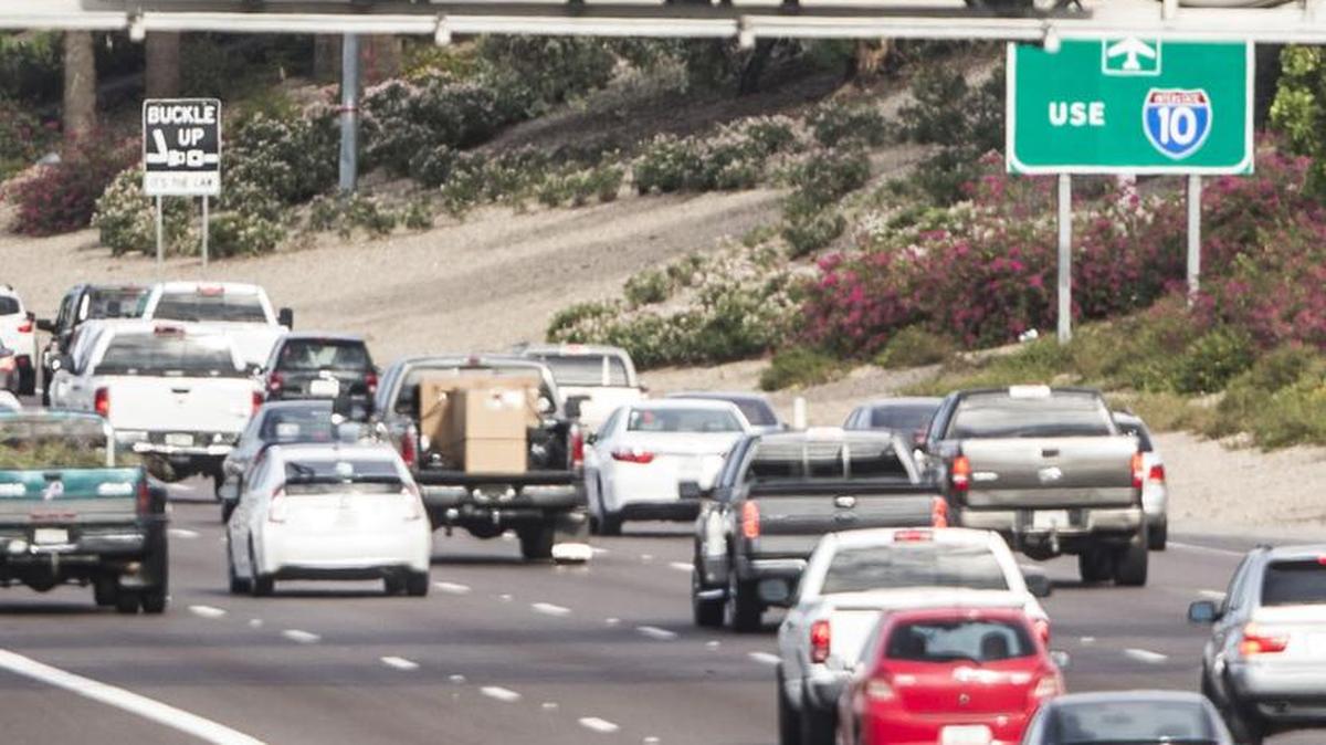 
A sign displays the shooter tip line on Interstate 10 in Phoenix earlier in September. Arizona officials reported Friday that a suspect had been arrested in a series of shootings on Phoenix highways.

