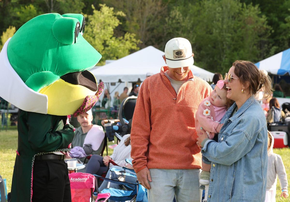 Glen the Frog greets a baby last spring in Rock Hill at the Come-See-Me Tailgate Party at Winthrop Lake. The Rock Hill region has some of the fastest-growing communities in South Carolina, the nation’s fastest-growing state.