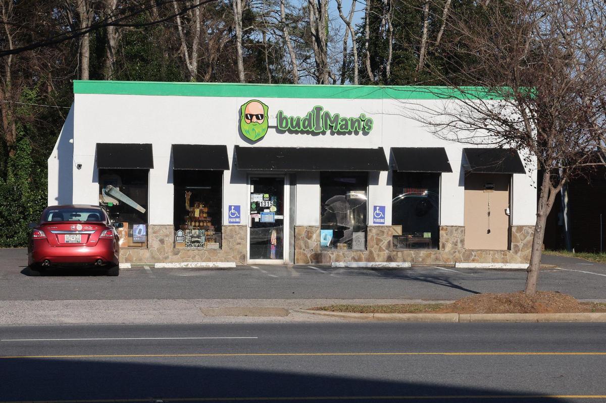 Two people were killed and another wounded in a shooting Wednesday night at Budiman’s Smoke Shop before officers caught the shooter.