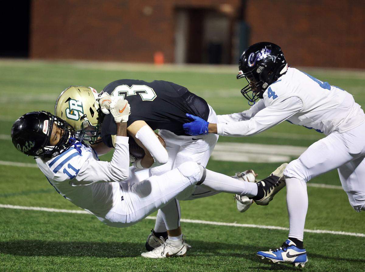 Woodmont’s Jordan Wilson (11) and Drake Stewart (4) tackle Catawba Ridge’s Brayden Wasik Friday, Nov. 11, 2024 in Fort Mill, S.C.