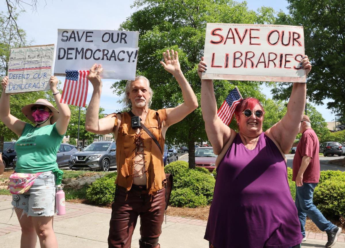 Demonstrators with York County Rising protest President Trump and his policies Sautrday in downtown Rock Hill.