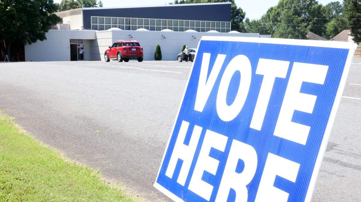 A “vote here” sign lets voters know their precinct is located at Tega Cay Baptist Church in York County in the 2024 June primary election.