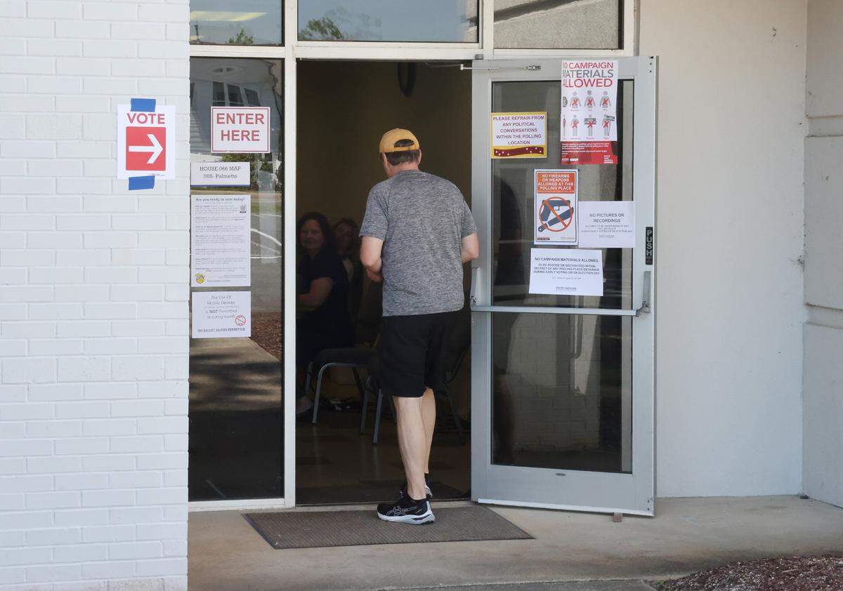 A voter walks into a precinct at Tega Cay Baptist Church Tuesday.