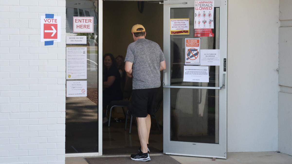 A voter walks into a precinct at Tega Cay Baptist Church Tuesday.