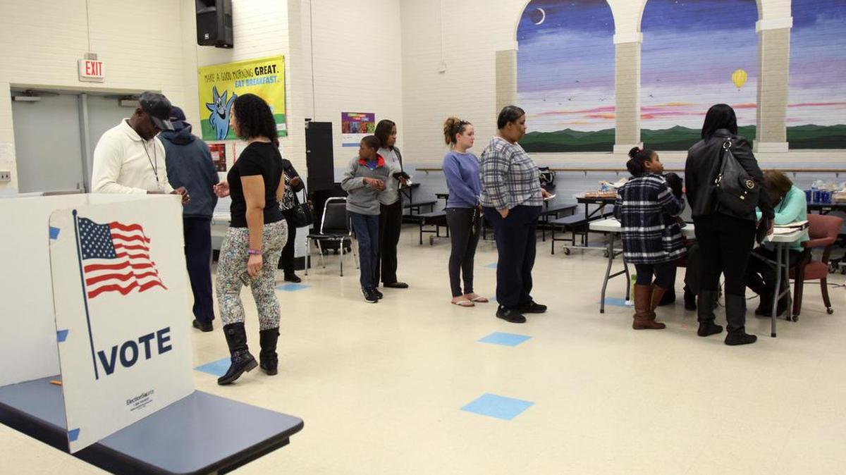 Voters wait in line at Sunset Park Elementary School Saturday.