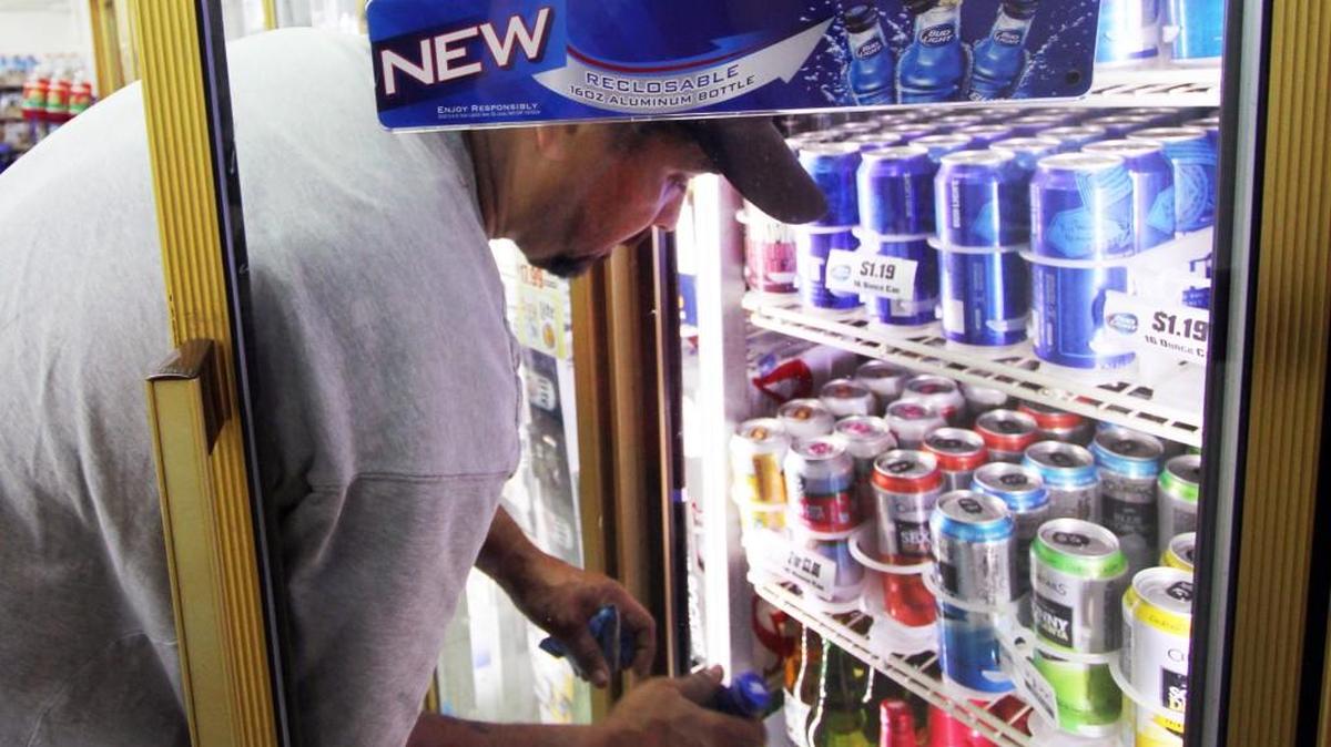 Clint Cauthen buys beer Tuesday at Danny's Food Pantry in Chester.