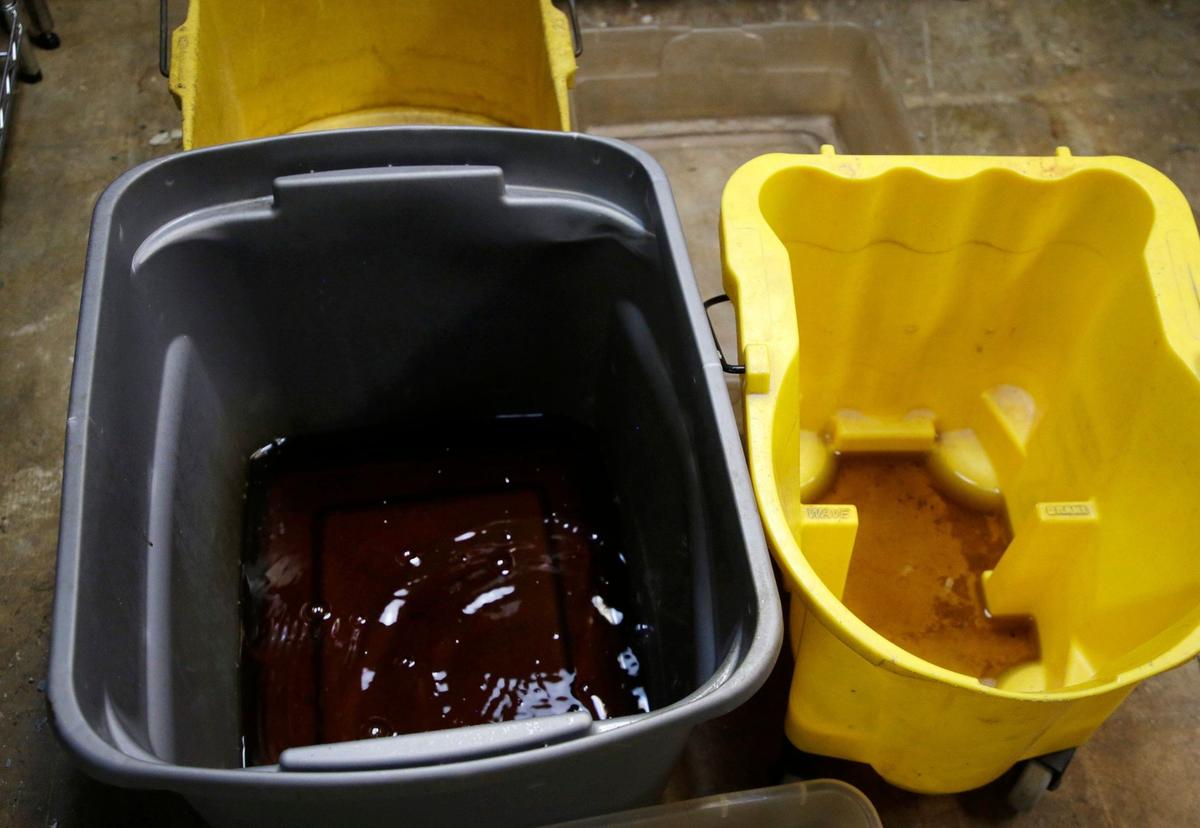 Brown murky water drips into buckets Friday at Family Promise of York County.
