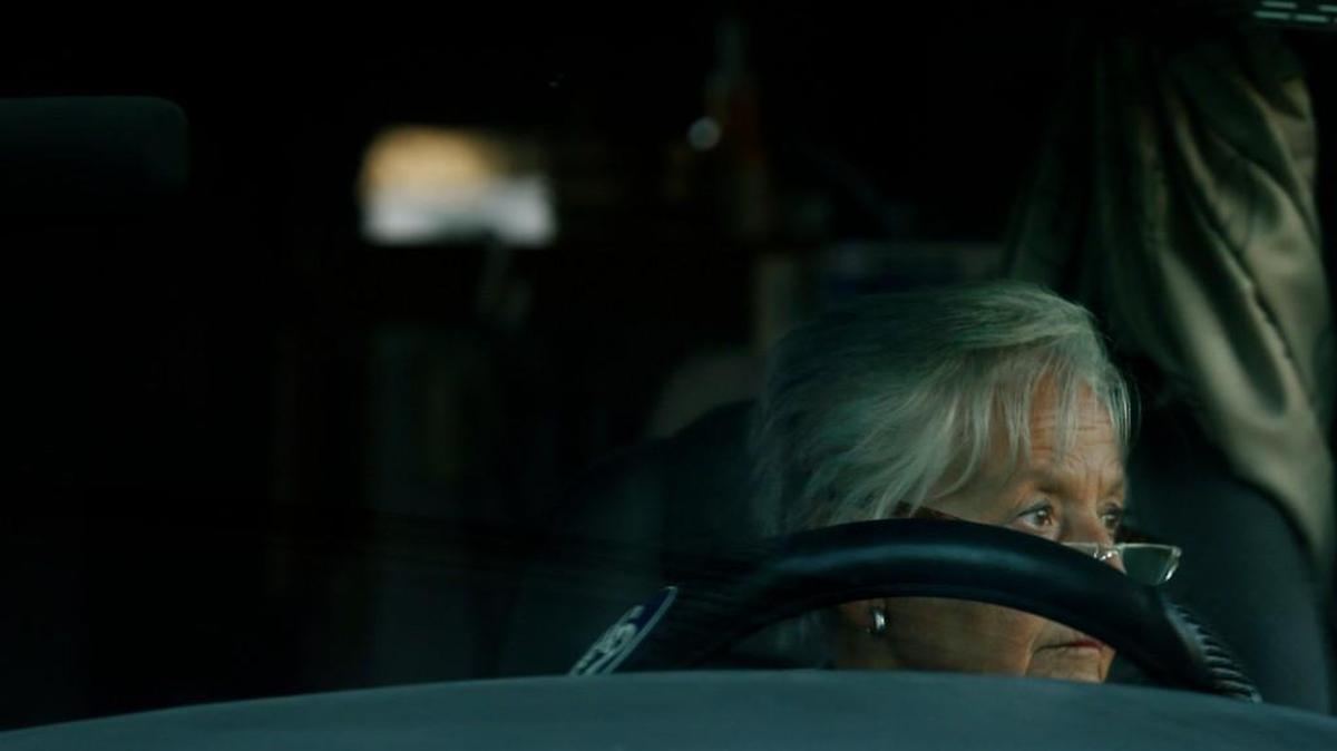 Dolores Westfall looks small behind the wheel of the motor home she calls “Big Foot” as she drives away from the Darien Lake theme park camp site in upstate New York.