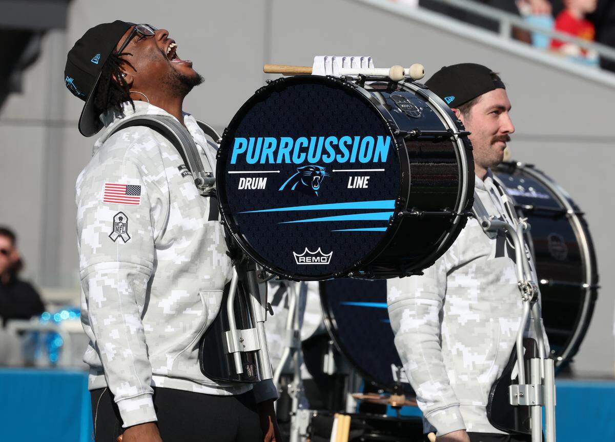 A member of the “Purrcussion” team yells during the Panthers game Sunday.