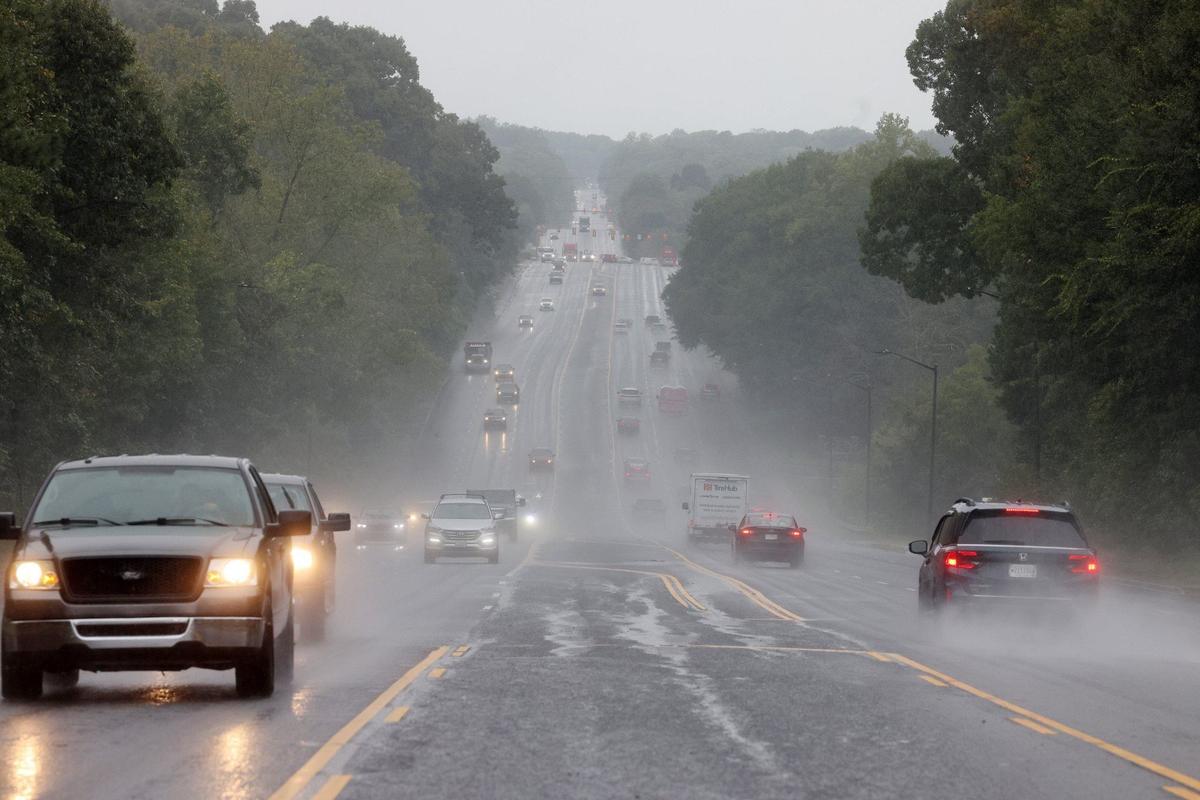 Traffic flows down Celanese Road in Rock Hill on Thursday, Sept. 26, as heavy rain from Helene falls.
