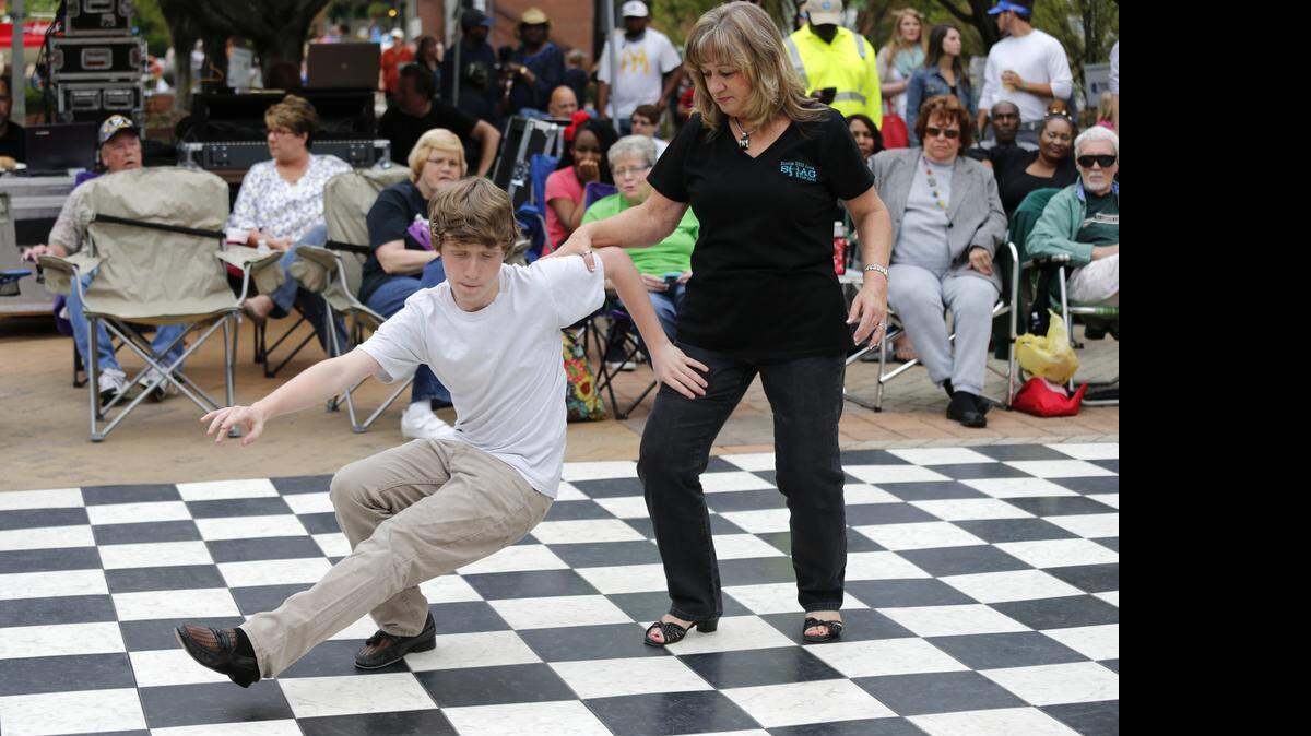 
The Beach Bash Come-See-Me event Friday in downtown Rock Hill. Debbie Brown dances the Shag with her grandson Kaleb Brown, 14, at the Beach Bash.

