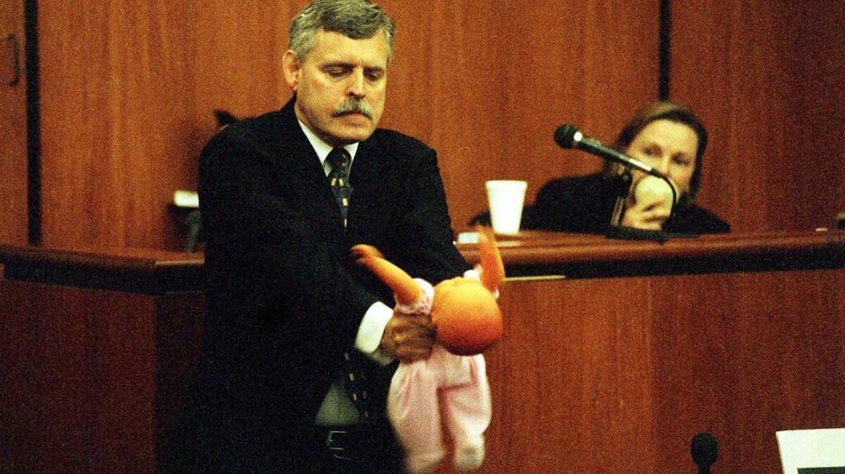 Expert prosecution witness Dr. Randell Alexander of Morehouse Medical Center in Atlanta demonstrates the violent shaking involved in Shaken Baby Syndrome during Gail Cutro’s 1999 trial. The demonstration was so shocking a juror left the courtroom, causing the defense team to motion for a mistrial.