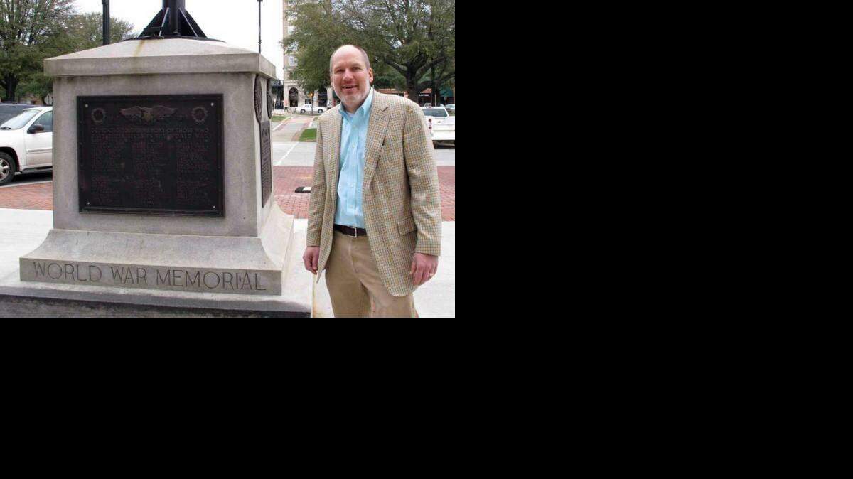 
Greenwood Mayor Welborn Adams stands beside the Greenwood County memorial in Greenwood, S.C., that honors its citizens who died in recent wars. 
