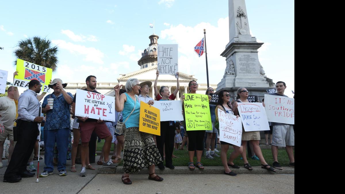 People gathered on the South Carolina State House grounds Saturday to show support for taking down the Confederate battle flag. The rally stemmed from the recent shootings of nine black parishioners in Charleston.