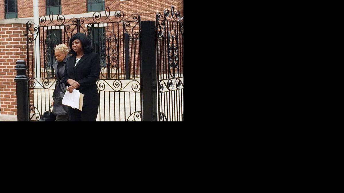 
Dinkins-Robinson, right, leaves the federal courthouse in Columbia last week.
