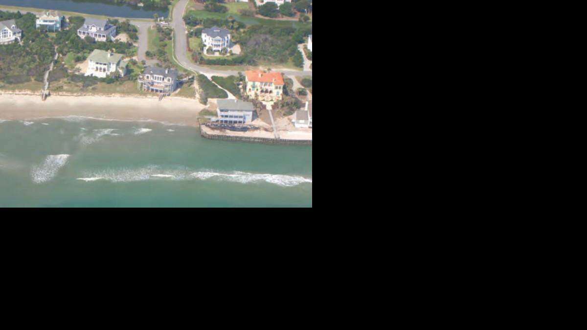 
Part of the seawall that juts into the ocean at Debordieu Beach, S.C., will be replaced after the state Legislature changed a quarter century of coastal law last year to allow for construction of the wall. The existing seawall in this photograph is at the right.
