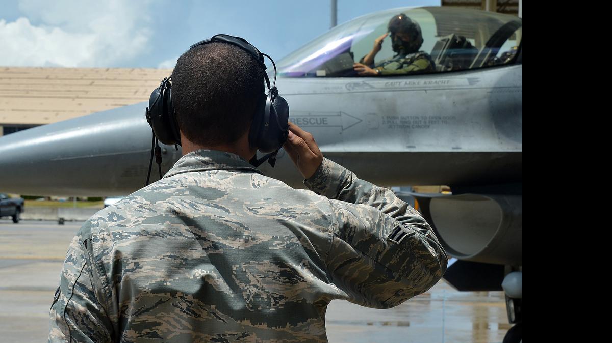
An airman salutes an F-16 Fighting Falcon during the exercise Weasel Victory 15-06 at Shaw Air Force Base. Several F-16s flew sorties during the exercise.
