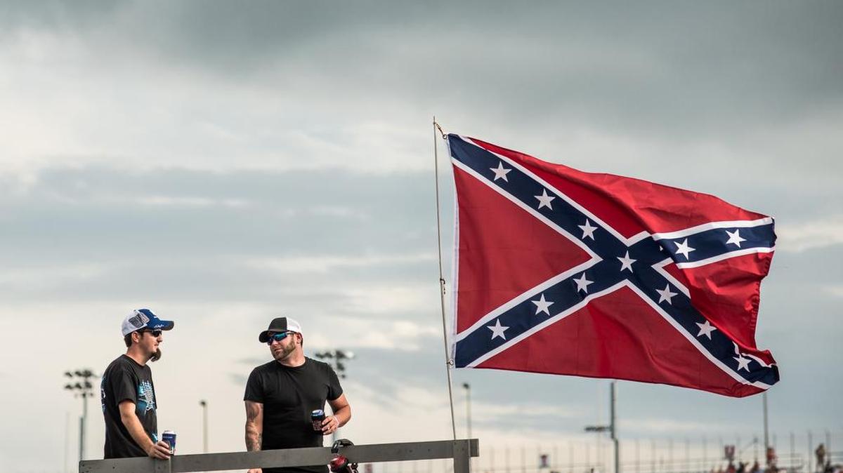 
Race fans tailgate Saturday afternoon at the Southern 500 in Darlington, South Carolina. Following the June massacre in Charleston and the removal of the Confederate battle flag from the statehouse grounds the traditional symbol for southern race fans continues to face scrutiny. 9/6/15 
