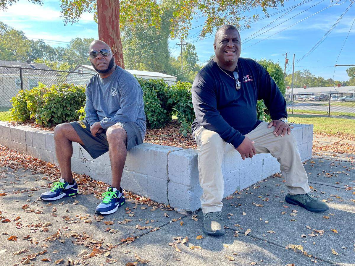 William “Q-Rock” Cureton, right, and Michael Burris, left, pose for a picture at Moore Street Park near Green Street in Rock Hill. The two started the group Men on a Mission, which goes to different neighborhoods and parks and beautifies them.