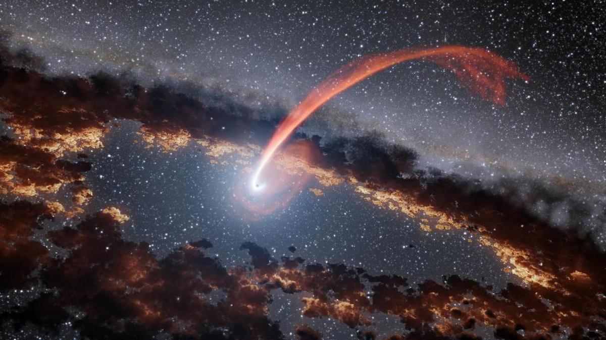 Illustration shows a glowing stream of material from a star as it is being devoured by a supermassive black hole in a tidal disruption flare.