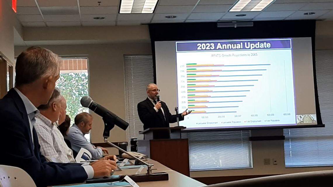 S.C. Sen. Michael Johnson, left, listens Friday as Rock Hill-Fort Mill Transportation Study administrator David Hooper discusses large road projects in the Rock Hill region.