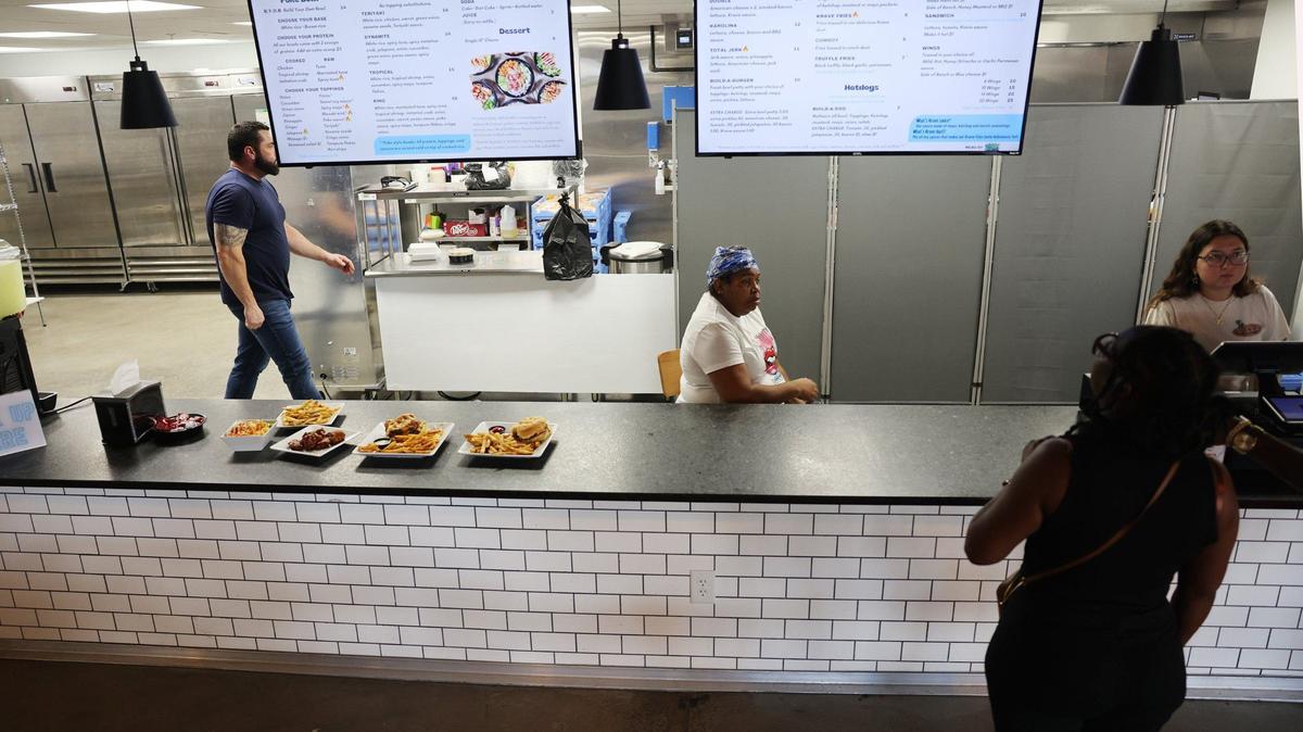 Madison Mellow, far right, takes an order from Sunshyne Patterson on Friday at The Power House in Knowledge Park.