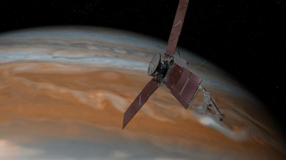 This artist’s rendering provided by NASA and JPL-Caltech shows the Juno spacecraft above the planet Jupiter. Five years after its launch from Earth, Juno is scheduled to go into orbit around the gas giant on Monday.