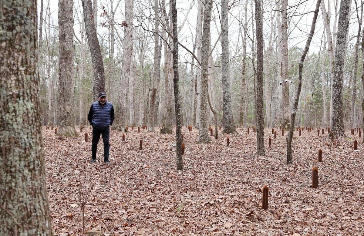 Anthony Johnson, pastor at Mount Zion Baptist Church, walks through a cemetery of enslaved people at Historic Brattonsville.