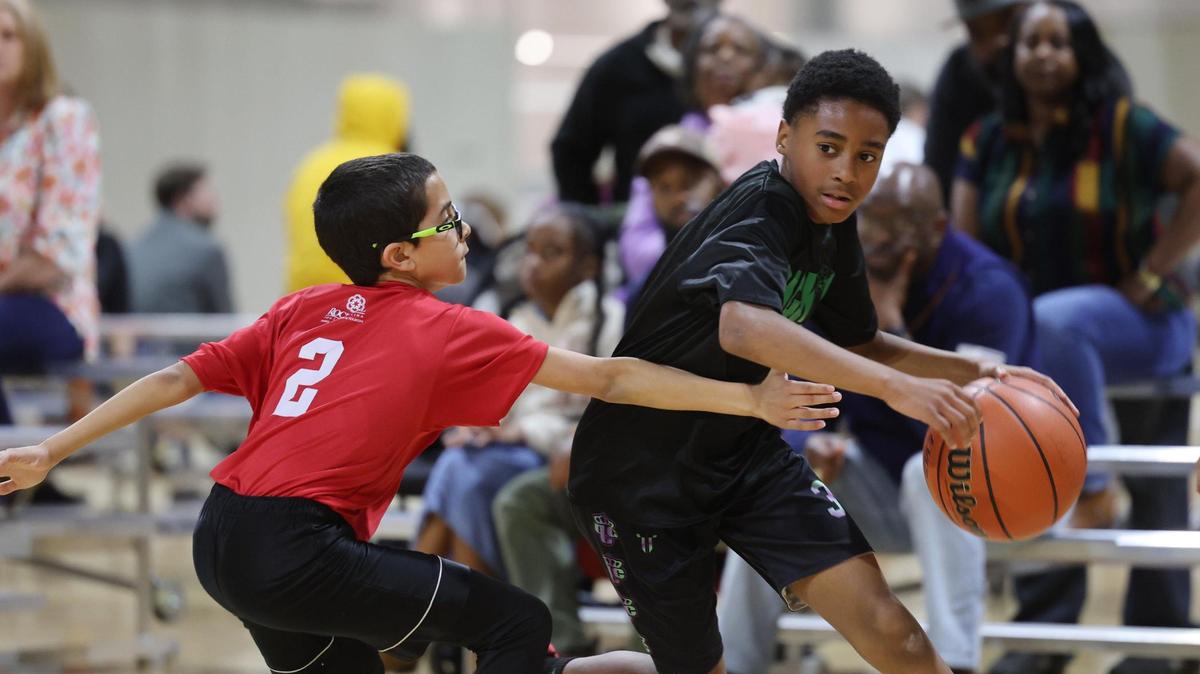 12-year-olds Kedric Thomas, left, and A.J. Cousar play basketball Wednesday at a City of Rock Hill Parks, Recreation and Tourism game at the Sports and Event Center. York County Council could add a countywide tax but cut money from recreation departments in York, Clover, Tega Cay or other city, town areas.