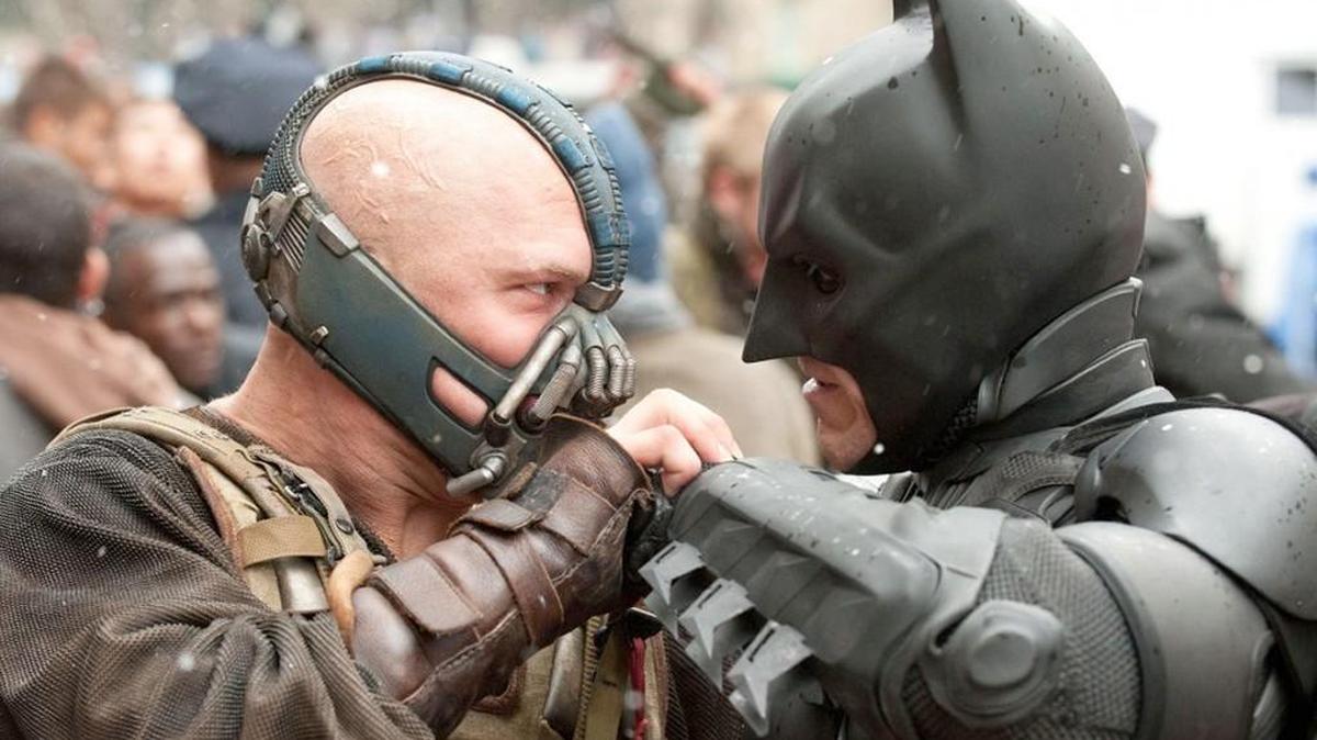 Tom Hardy as Bane and Christian Bale as Batman in “The Dark Knight Rises.”