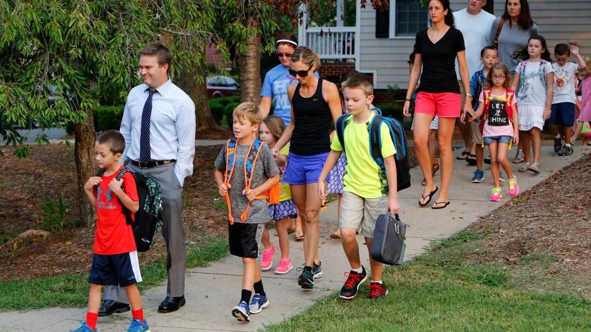 
Back to school Monday morning at Orchard Park Elememtary in Fort Mill. The school is in Baxter Village and many of the students walked with their parents to school on the first day. 
