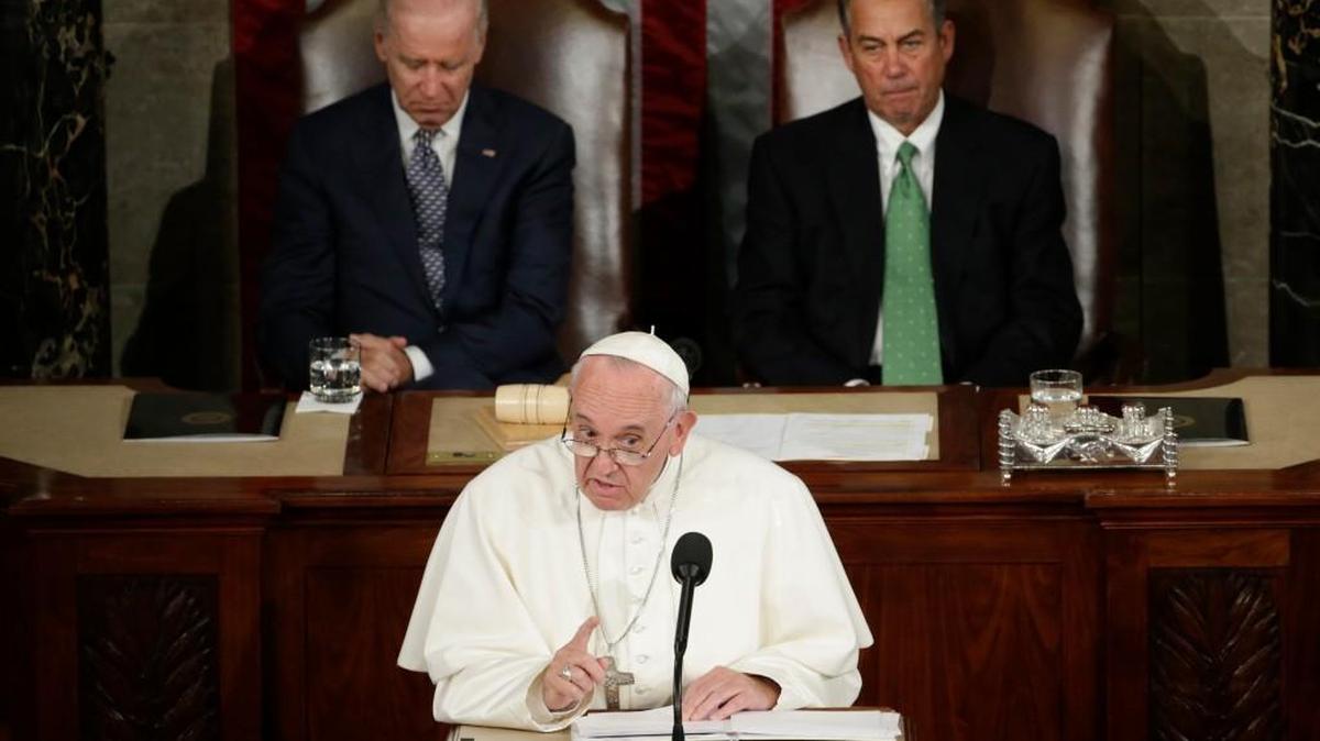 
Pope Francis addresses a joint meeting of Congress on Capitol Hill in Washington on Thursday, making history as the first pontiff to do so. Listening behind the pope are Vice President Joe Biden and House Speaker John Boehner of Ohio.
