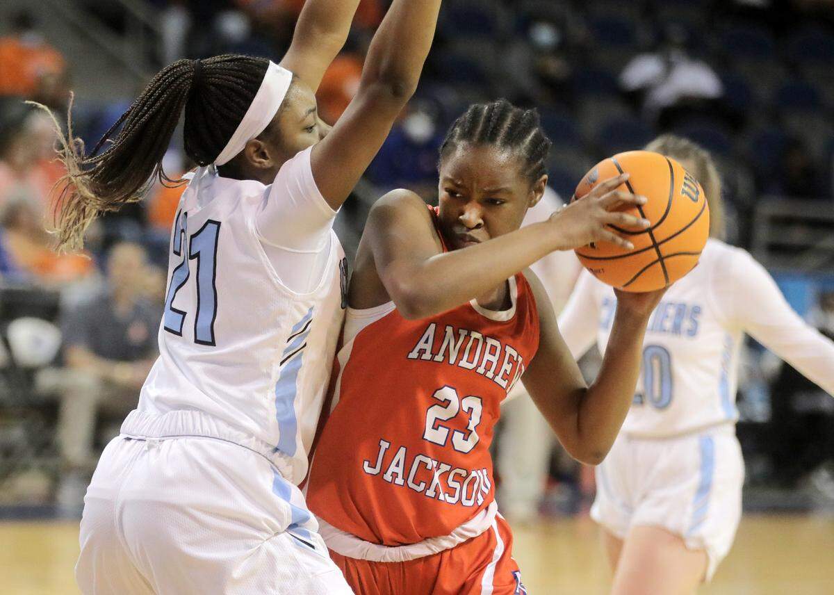 Andrew Jackson’s Tamia Watkins tries to shoot around Christ Church’s Yasmene Clark.