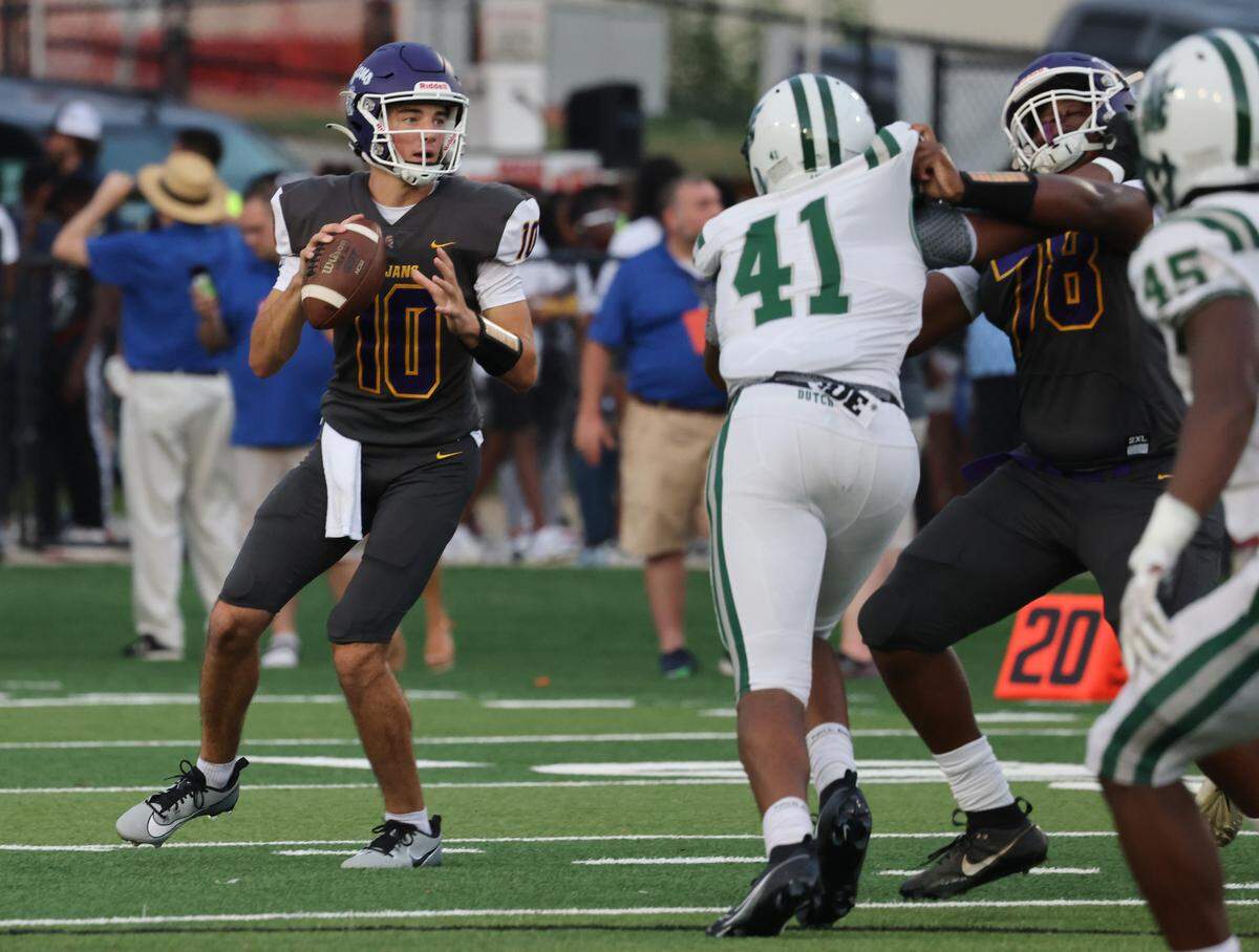 Northwestern High School quarterback Finley Polk looks for an opening Friday, Aug. 11, 2023 at District Three Stadium in Rock Hill, S.C.