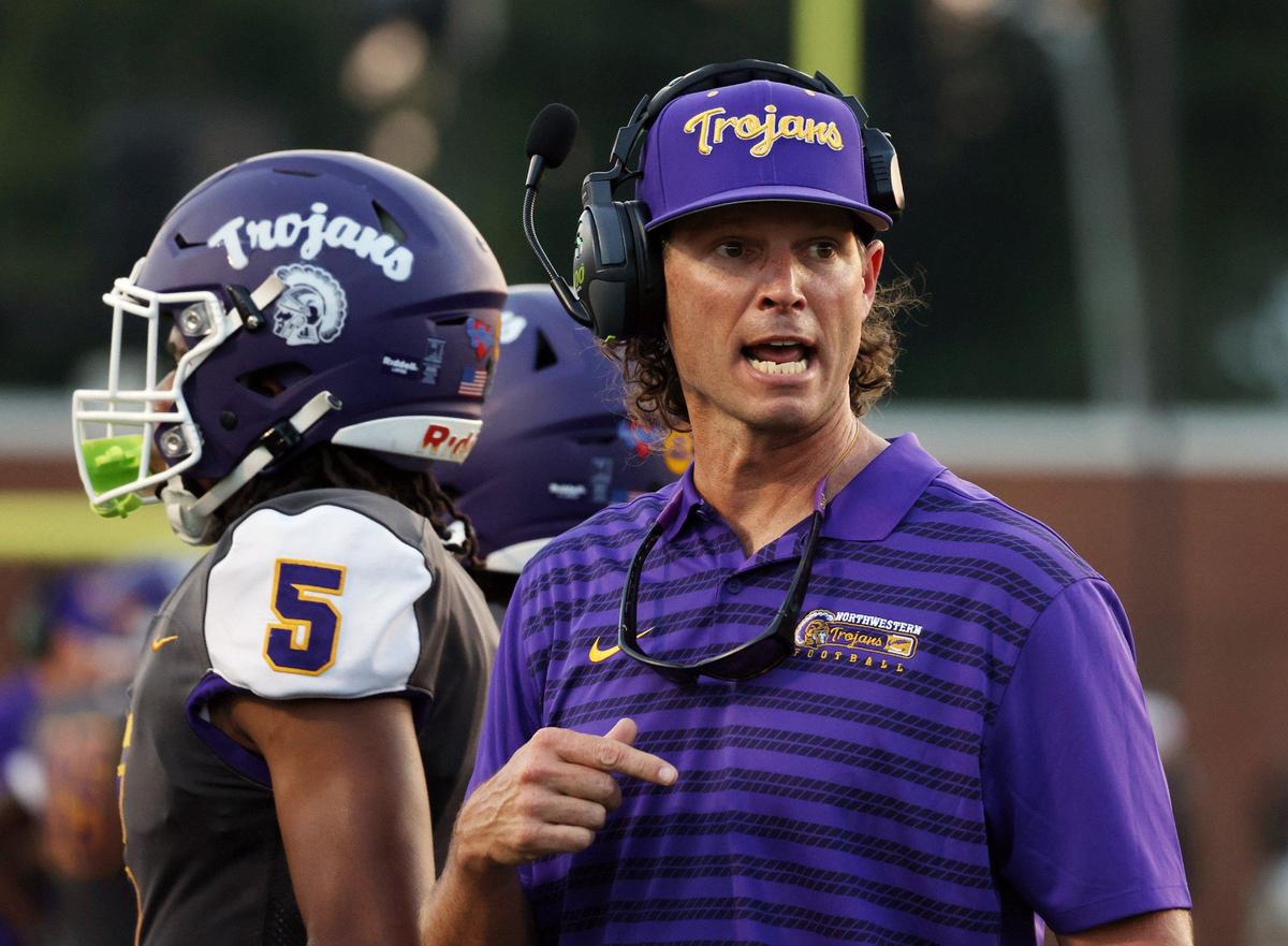 Northwestern High School head varsity football coach Page Wofford talks to a player Friday at the WRHI Football City USA scrimmage in Rock Hill.
