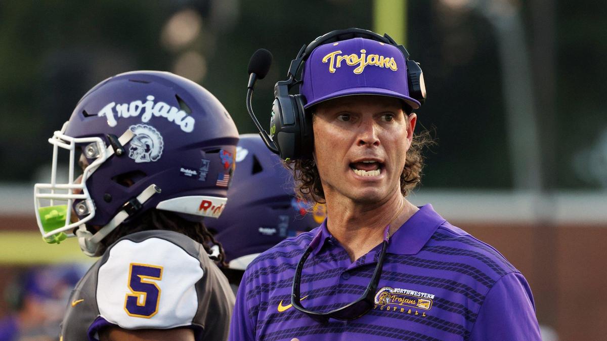 Northwestern High School head varsity football coach Page Wofford talks to a player Friday at the WRHI Football City USA scrimmage in Rock Hill.