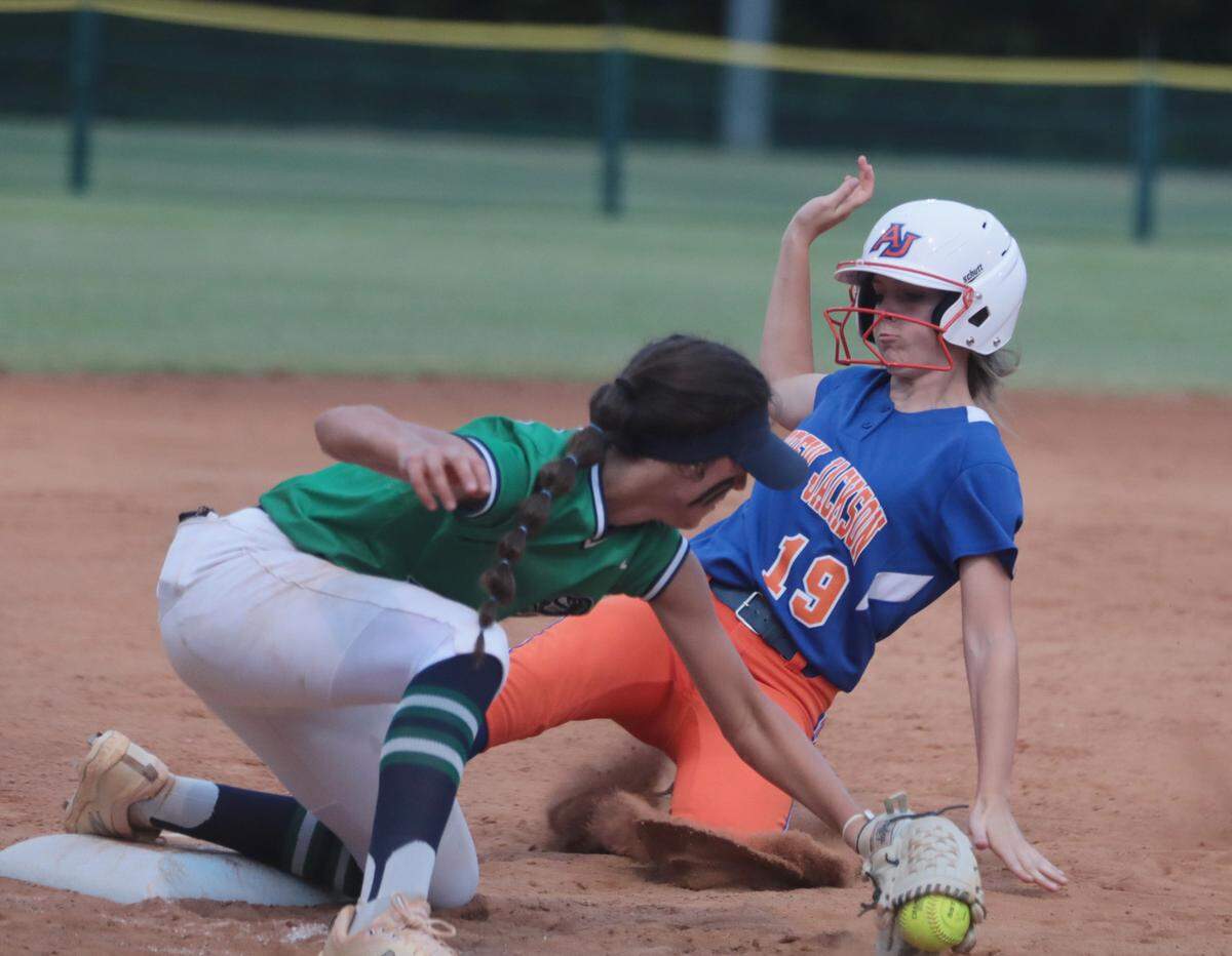 Andrew Jackson’s Karlee Starnes slides into third base as Legion’s Riley Burton takes the ball Thursday.