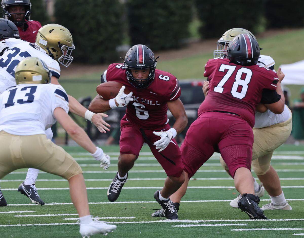 Rock Hill’s Daylen Boulware carries the ball Friday, Aug. 11, 2023 in Rock Hill, S.C.