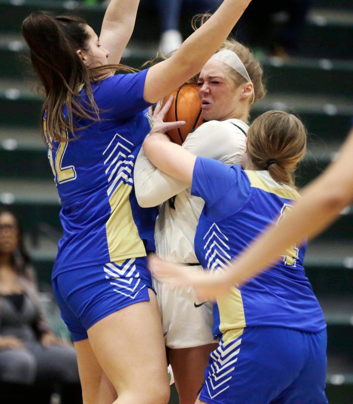 Catawba Ridge’s Morgan Davis, middle, fights for control of the ball over Indian Land’s Kaitlyn Knoll (32) and Ava Pensule.