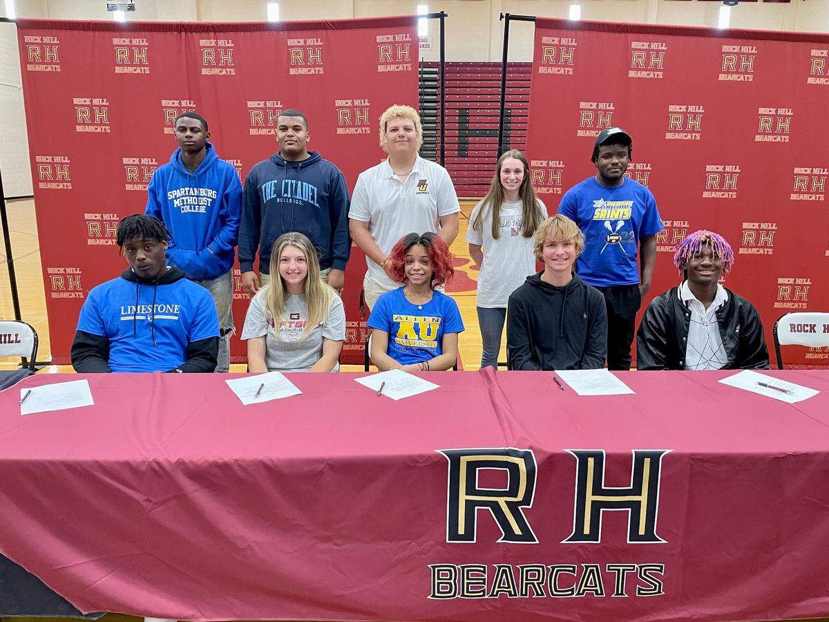 Rock Hill High athletes pose for a picture on Wednesday, May 4, 2022, after signing their National Letters of Intent to play college sports. From left to right (top row): Demarri Beatty, Waverly Brooks, Jackson Surratt, Gracie Wilson, Isiah Thomas. From left to right (bottom row): Jamarion Jones-Canty, Megan Lambert, Jayla Neely, Logan Rangnow, Irin Stradford.