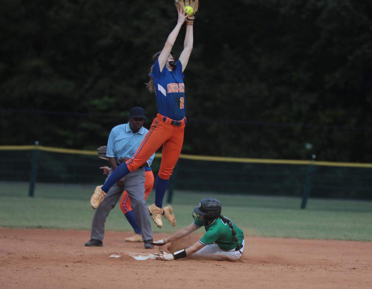 Andrew Jackson’s Maddi Baker jumps to catch the ball Thursday as Legion’s Gabi Wilson slides into second base.