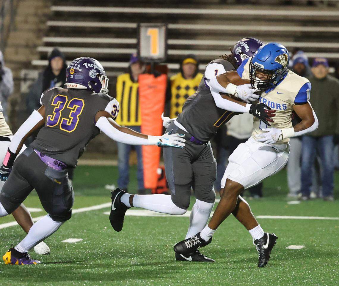 Northwestern’s Tamarion Watkins (1) blocks Indian Land’s Omarion Davis (1) during a 2024 game. Defending is Northwestern’s Kamerin Mcfadden (33).