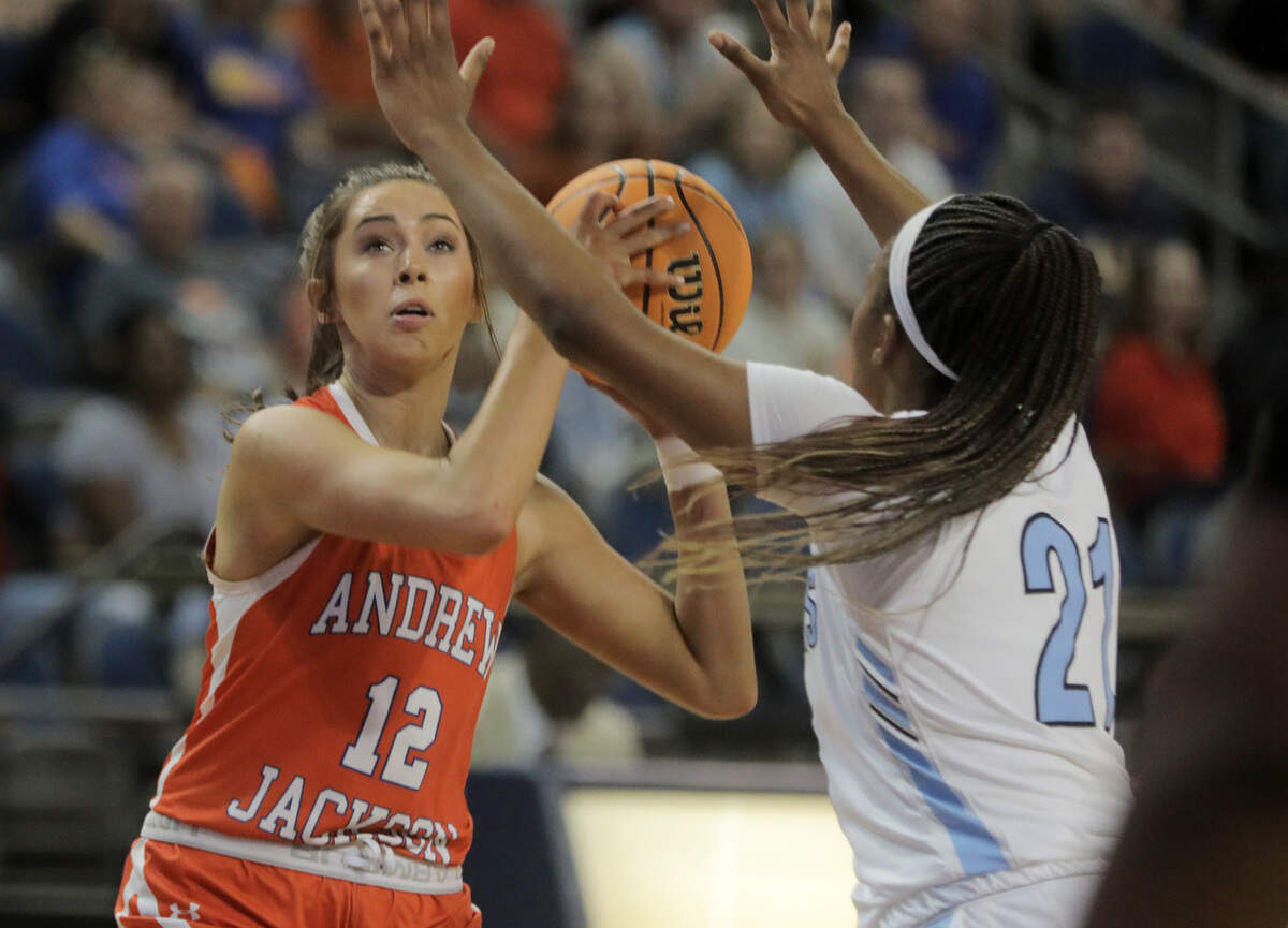Andrew Jackson’s Annsley Vick looks to the basket around Christ Church’s Yasmene Clark.