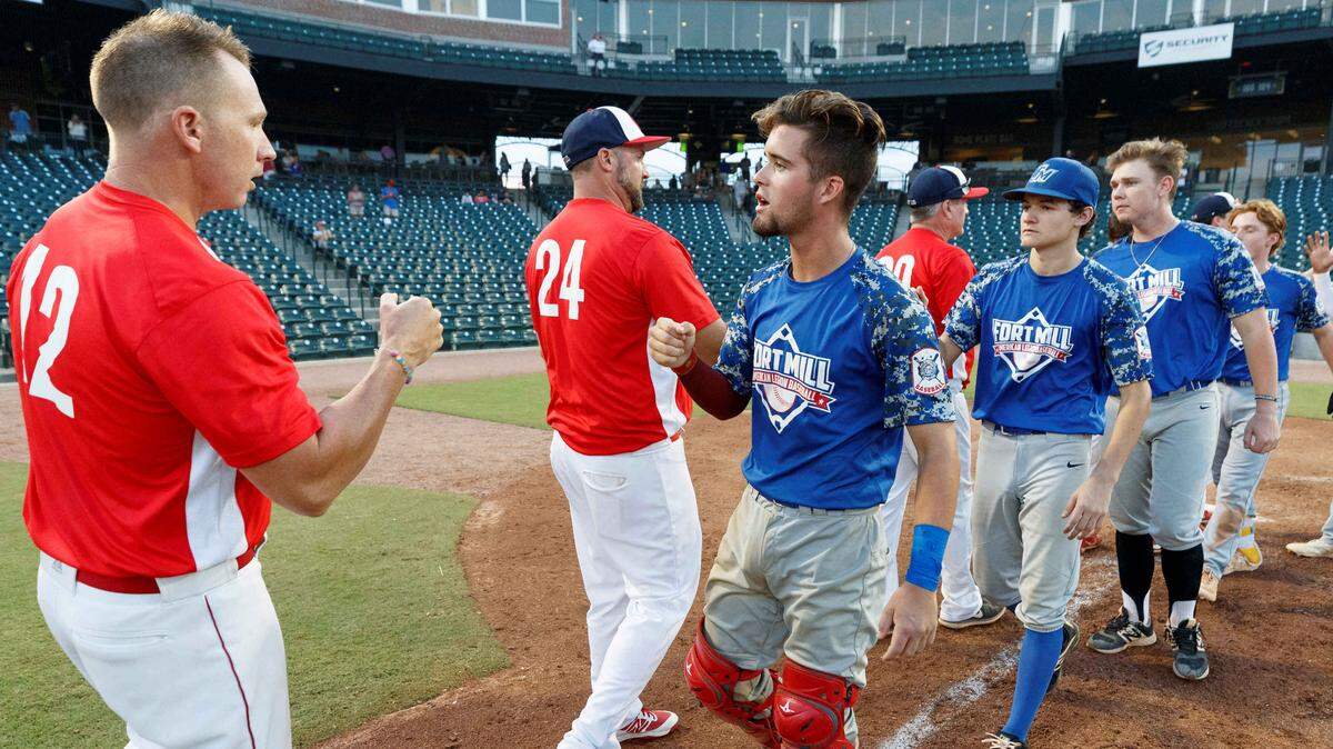 Fort Mill Post 43 and Greer Post 115 shake hands after the 2019 American Legion state championship game. Fort Mill and other teams in York, Chester and Lancaster counties are still involved in the 2022 American Legion playoffs.
