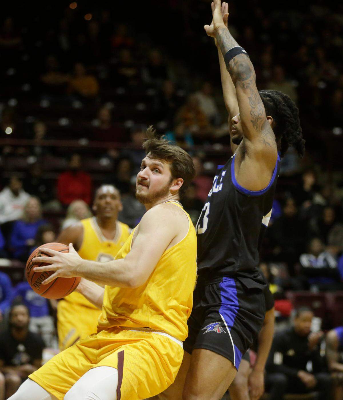 Winthrop’s Alex Timmerman, left, looks for an opening against Asheville’s Nick McMullen.