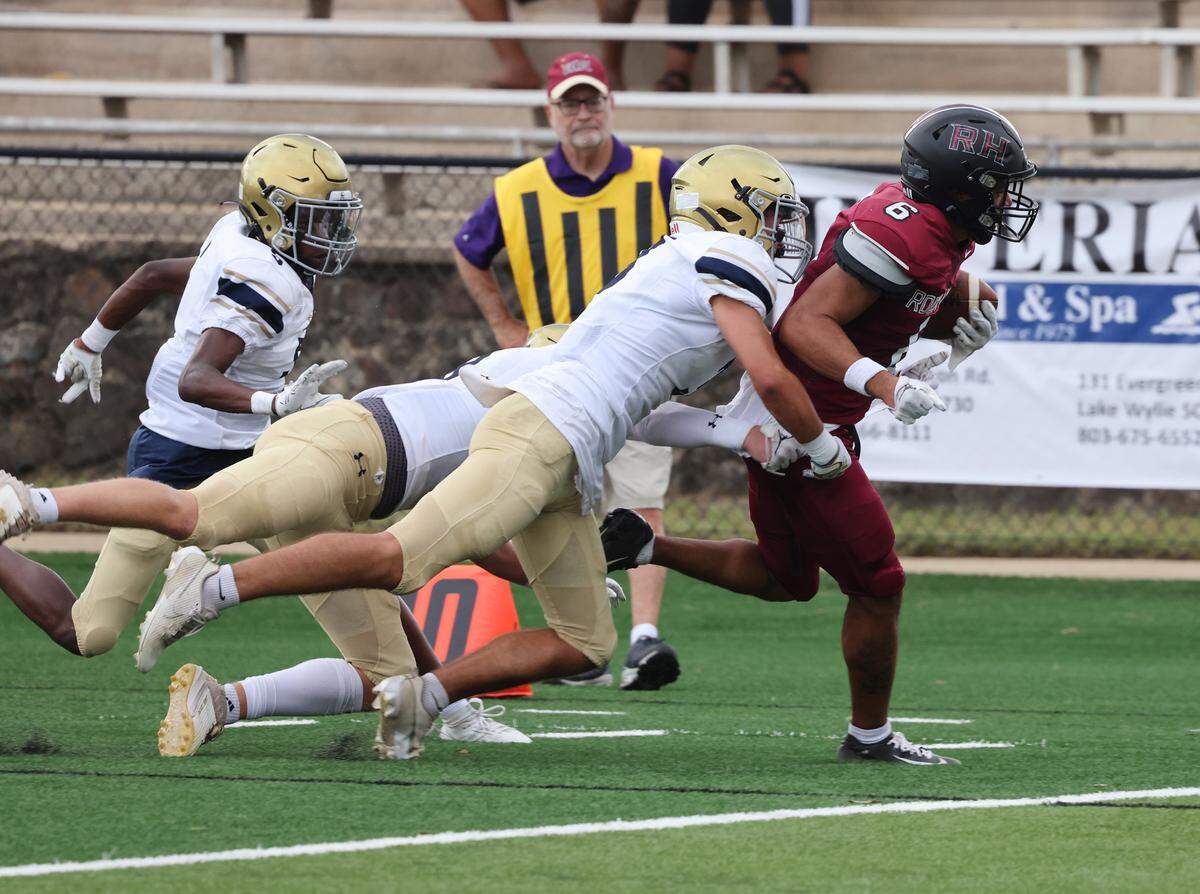 Rock Hill’s Daylen Boulware runs with the ball against Cuthbertson defense Friday, Aug. 11, 2023.
