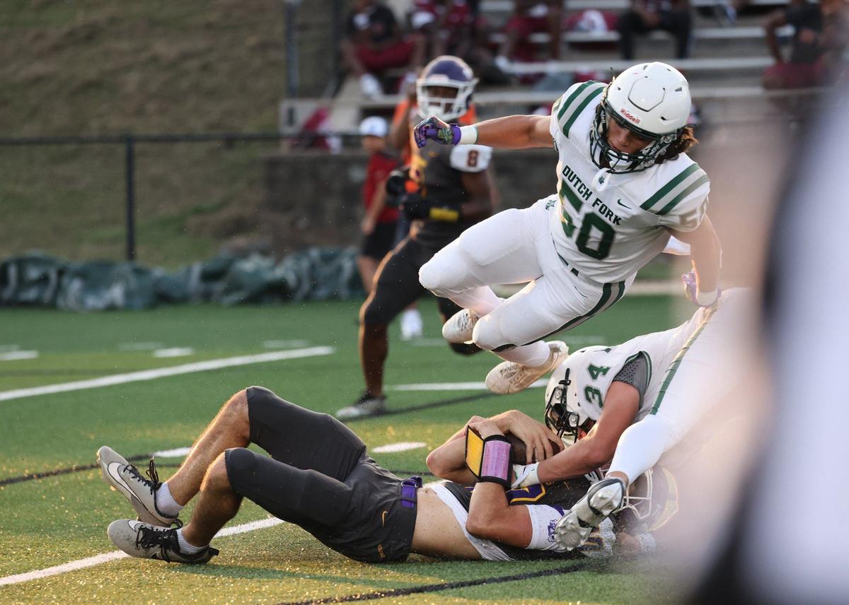 Northwestern’s Finley Polk is tackled Friday at the WRHI Football City USA scrimmage in Rock Hill.