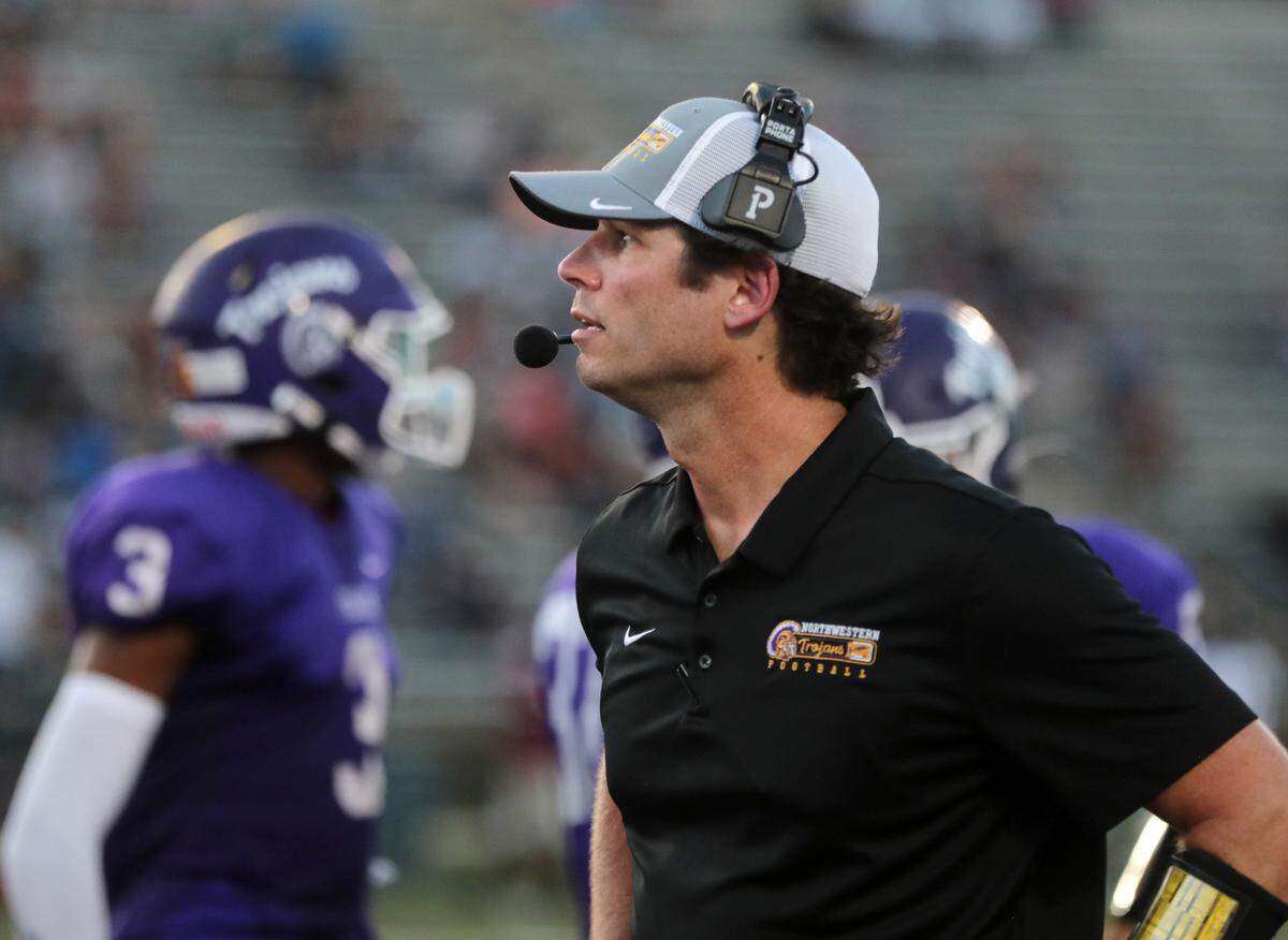 Northwestern coach Page Wofford watches the game.